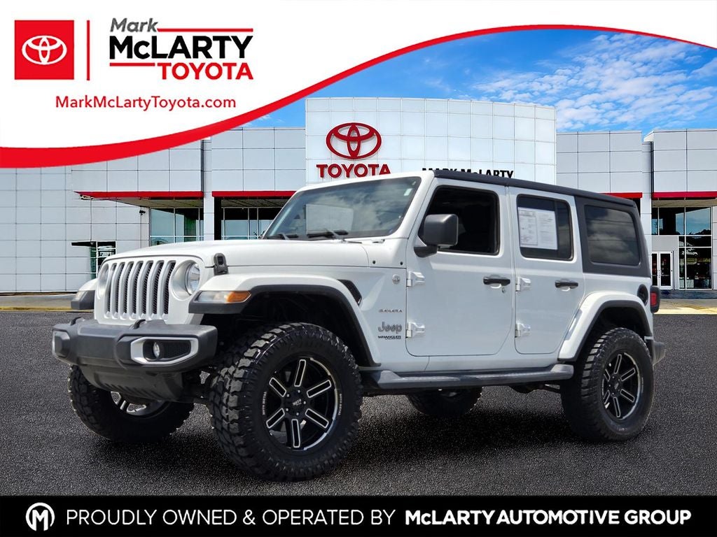 2018 Jeep Wrangler Unlimited Sahara in Bright White Clearcoat — front three-quarter view