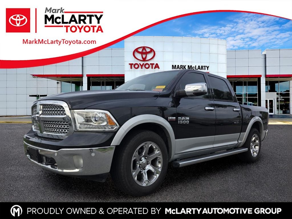 2016 RAM 1500 Laramie in Brilliant Black Crystal Pearlcoat — front three-quarter view