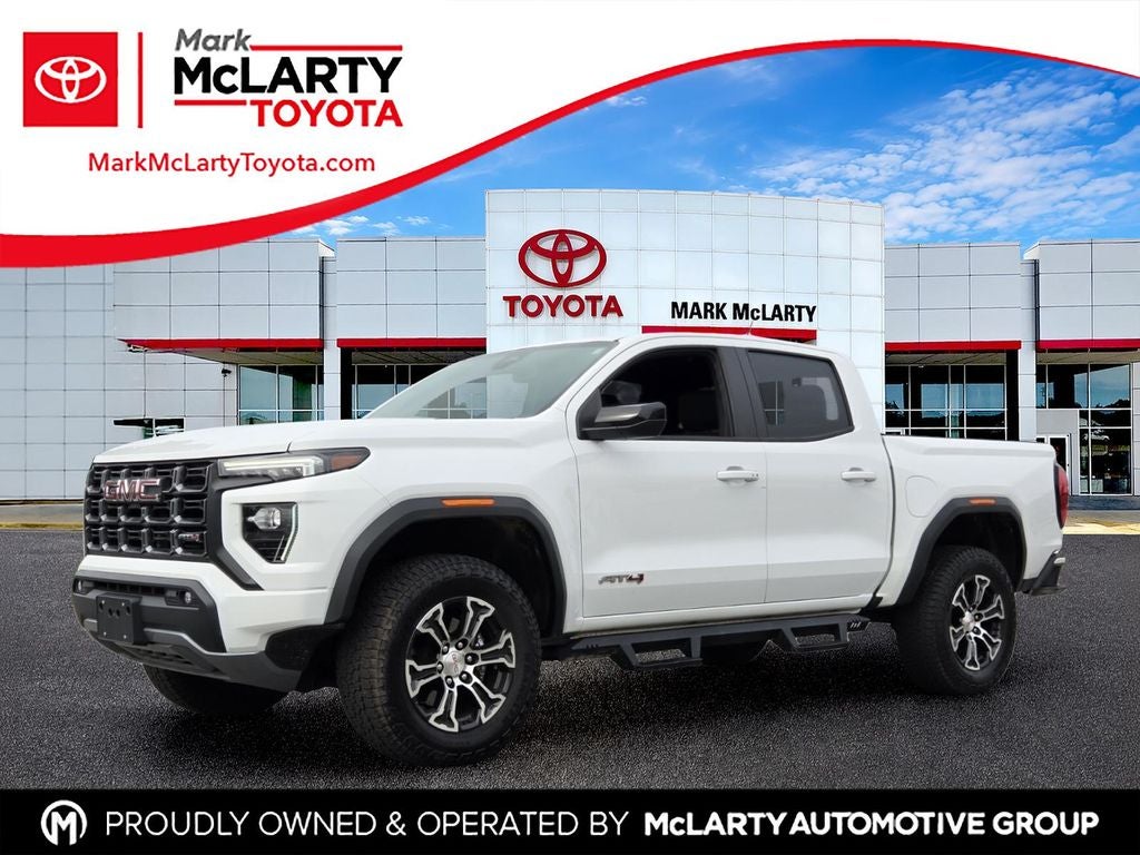 2023 GMC Canyon AT4 in Summit White — front three-quarter view