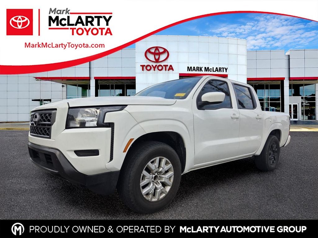 2023 Nissan Frontier SV in Glacier White — front three-quarter view