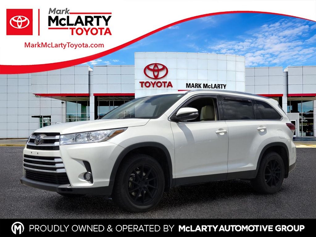 2019 Toyota Highlander XLE in Blizzard Pearl — front three-quarter view
