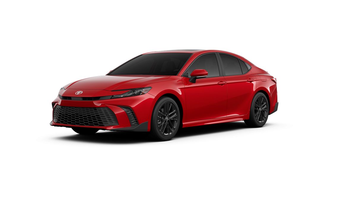 2026 Toyota Camry SE in Supersonic Red — front three-quarter view
