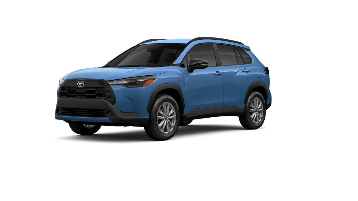 2026 Toyota Corolla Cross LE in Cavalry Blue — front three-quarter view