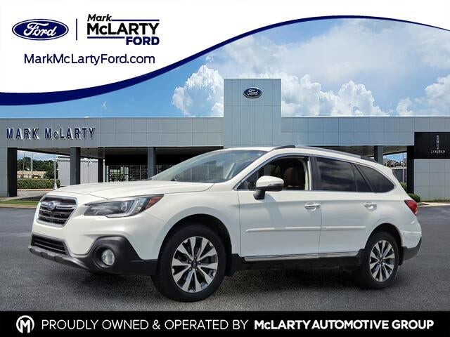 2019 Subaru Outback 2.5i Touring in Crystal White Pearl — front three-quarter view