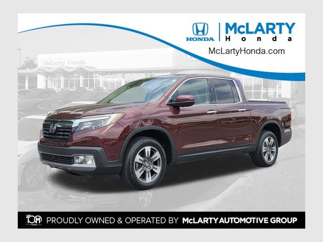 2017 Honda Ridgeline RTL-E in Deep Scarlet Pearl — front three-quarter view