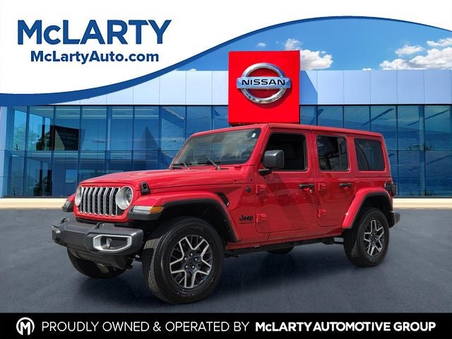 2025 Jeep Wrangler Sahara in Firecracker Red Clearcoat — front three-quarter view