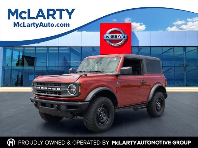 2023 Ford Bronco Black Diamond in Hot Pepper Red Metallic Tinted Clearcoat — front three-quarter view