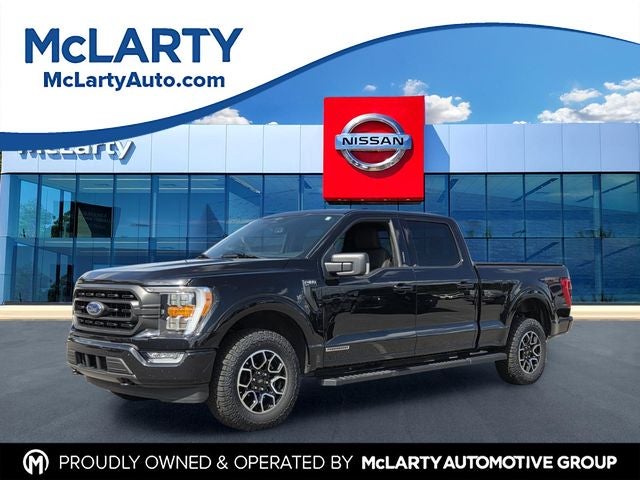 2023 Ford F-150 XLT in Black Metallic — front three-quarter view