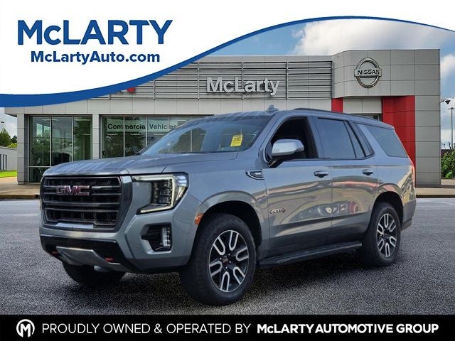 2023 GMC Yukon AT4 in Sterling Metallic — front three-quarter view