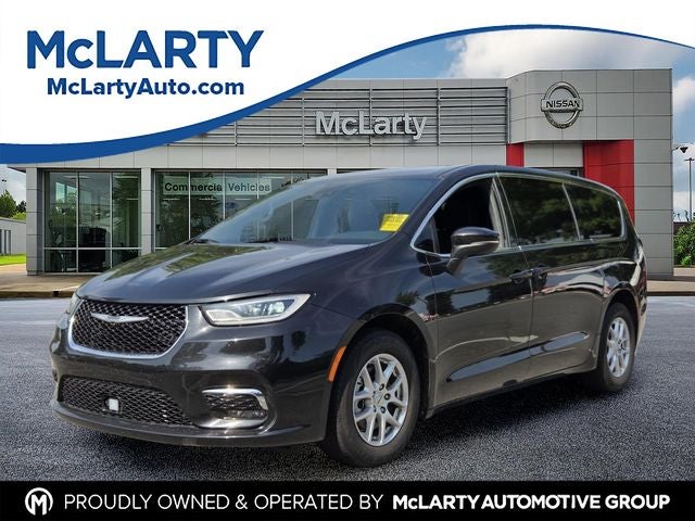 2023 Chrysler Pacifica Touring in Brilliant Black Crystal Pearlcoat — front three-quarter view