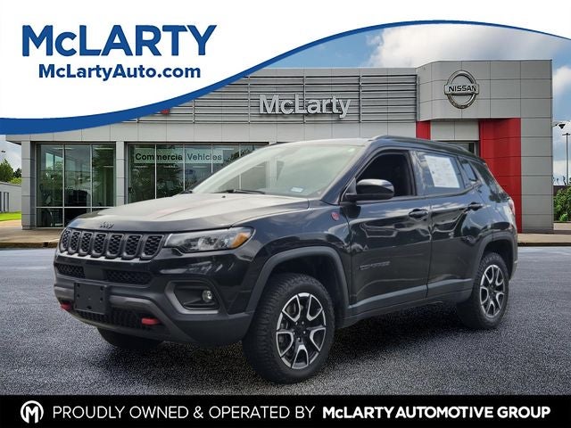 2024 Jeep Compass Trailhawk in Diamond Black Crystal Pearlcoat — front three-quarter view