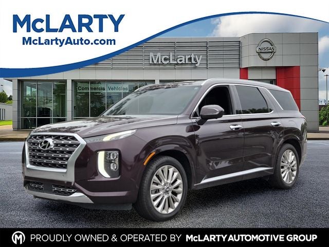 2020 Hyundai Palisade Limited in Sierra Burgundy — front three-quarter view